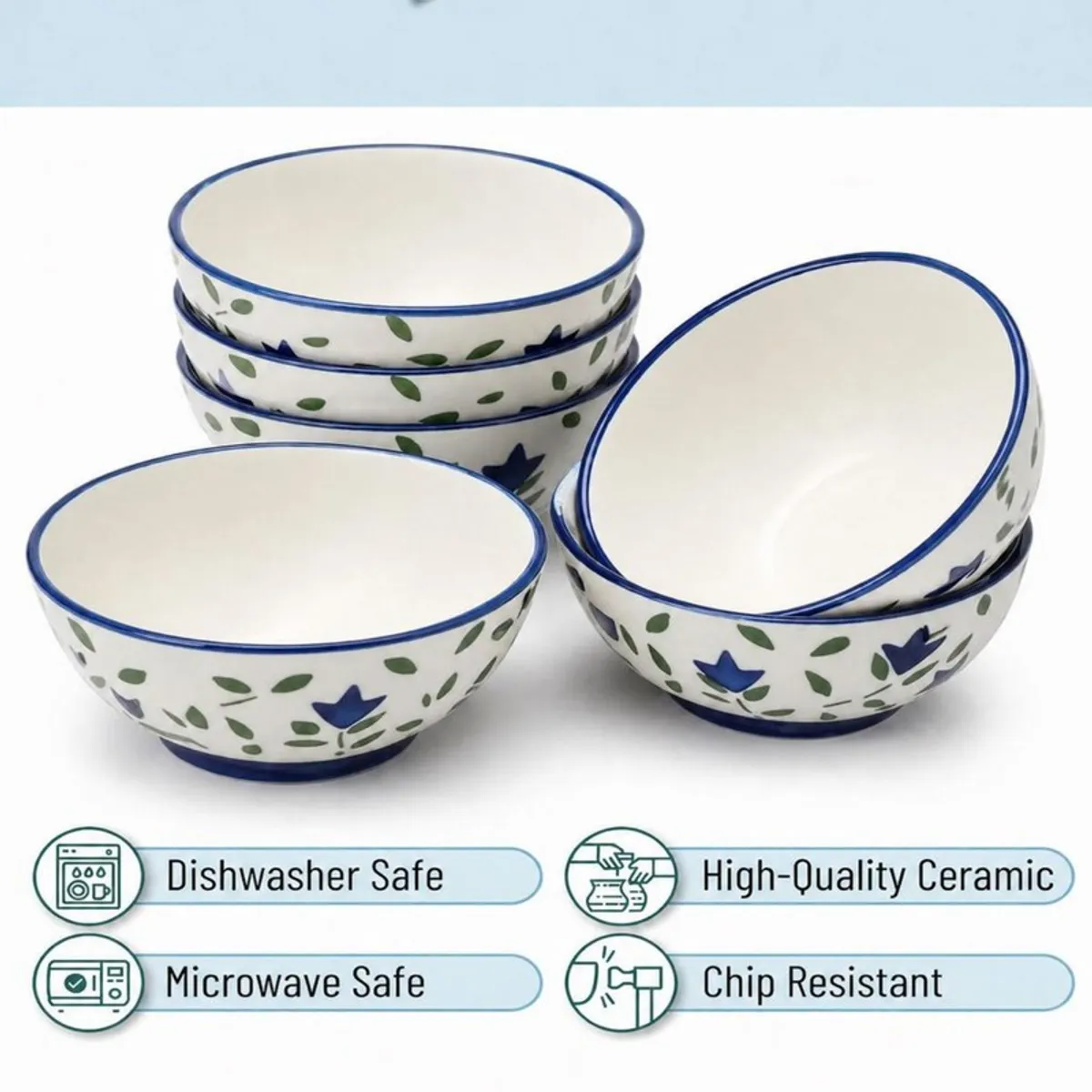 Stacked blue and white floral bowls with snacks and yoghurt in a kitchen setting