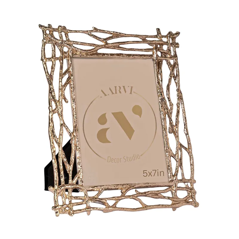Side angled view of the gold metal photo frame with openwork border