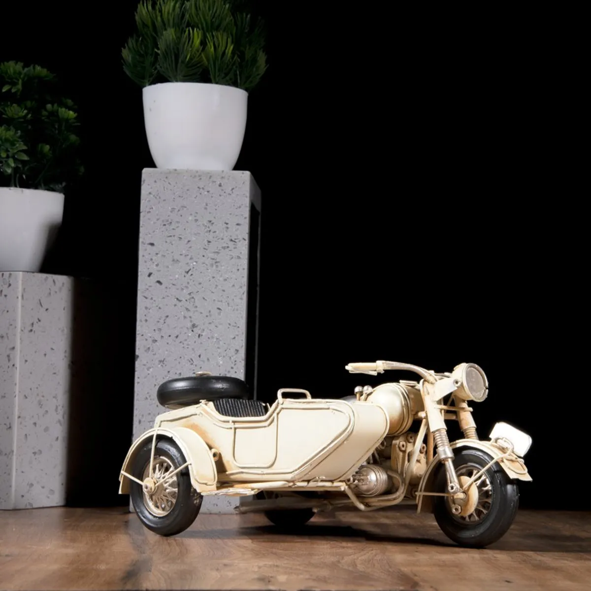Side view of vintage-style motorcycle with sidecar showpiece