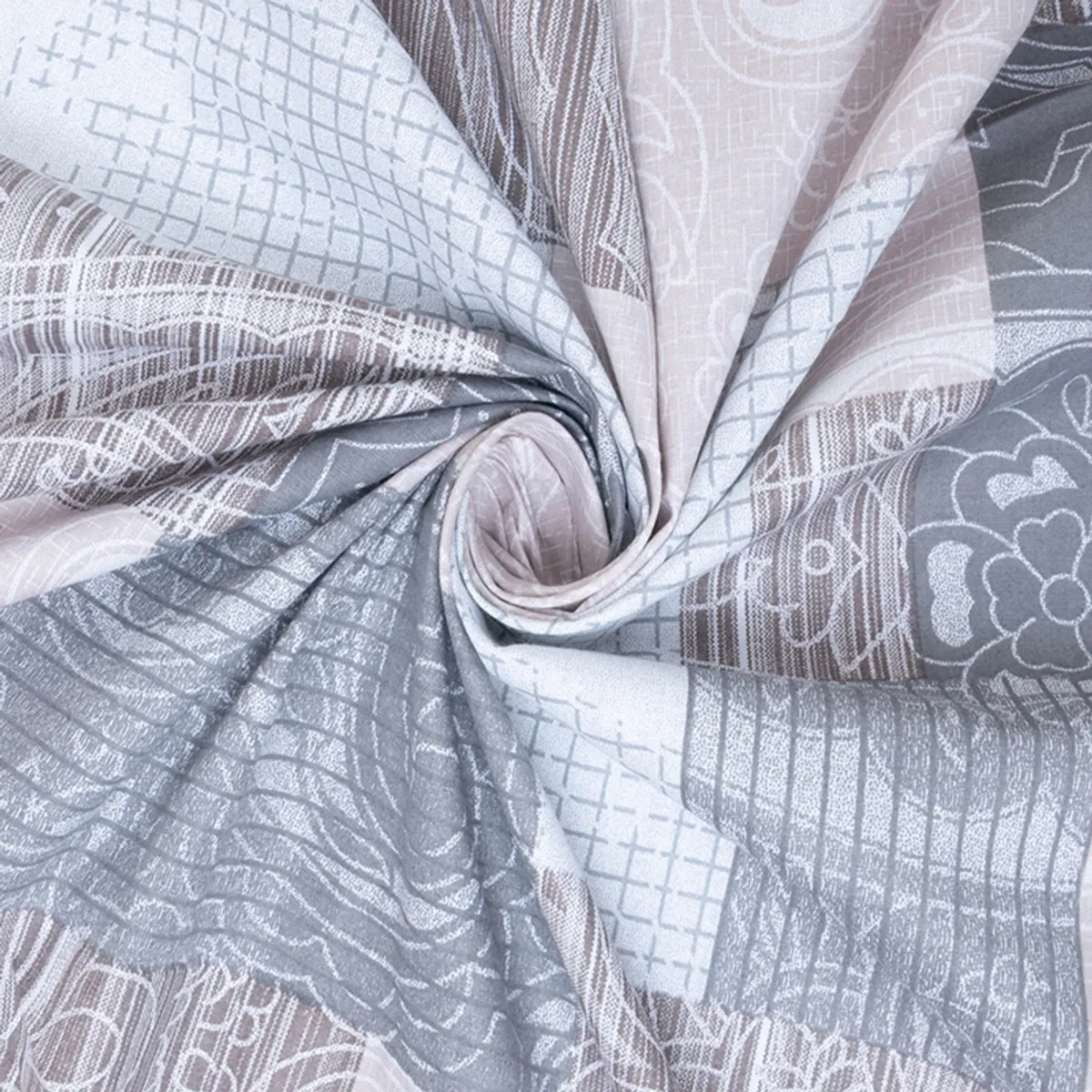 Close-up of the bedsheet fabric twisted to show the grey and beige printed pattern