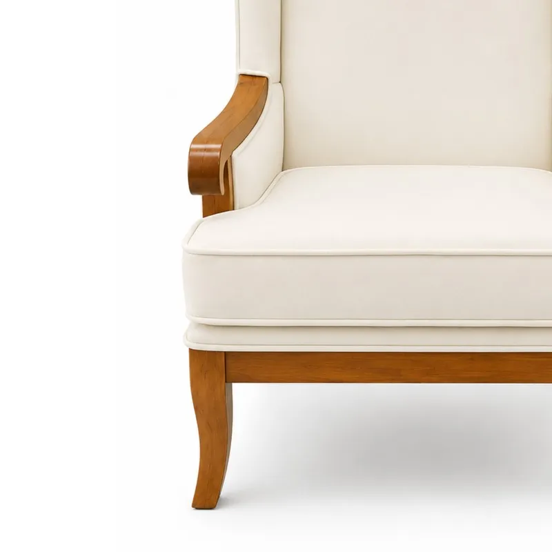 Close-up of white seat cushion and wooden arm of the lounge chair