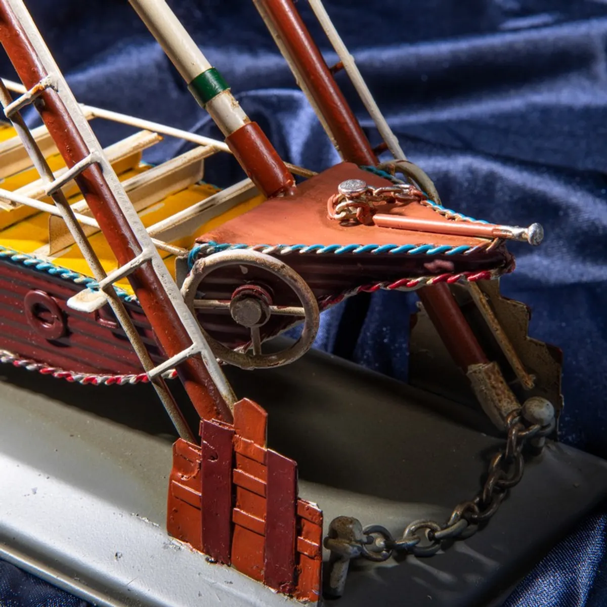 Close-up of the front detailing and chain on the iron boat showpiece