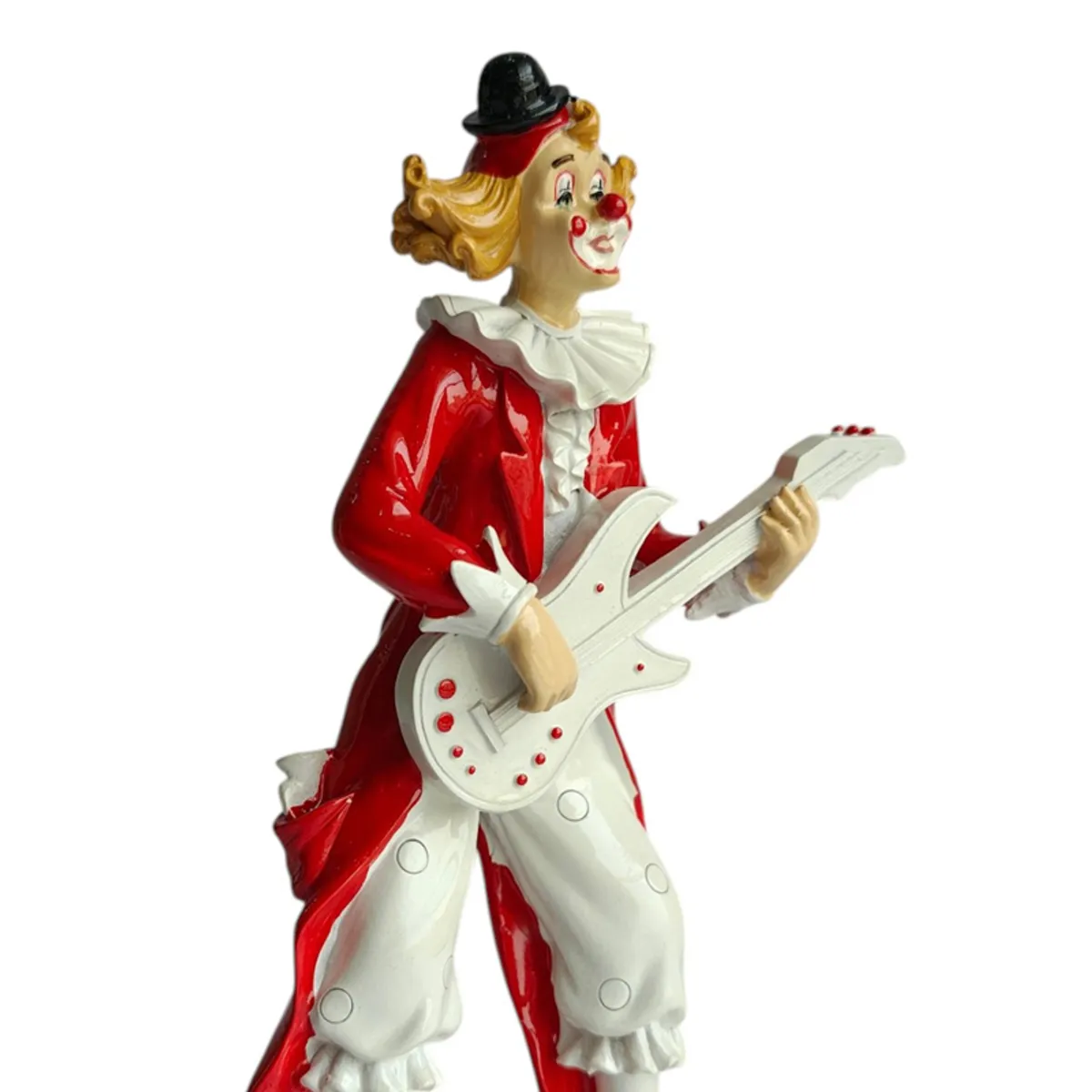 Close side view showing the clown figurine's glossy red outfit and white banjo