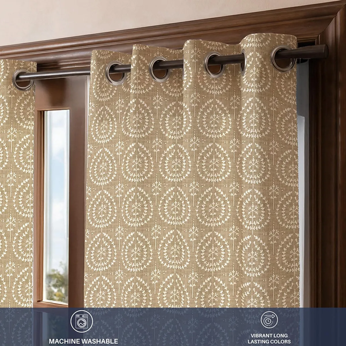 Beige patterned curtain shown close up with a dark eyelet rod hanging detail.