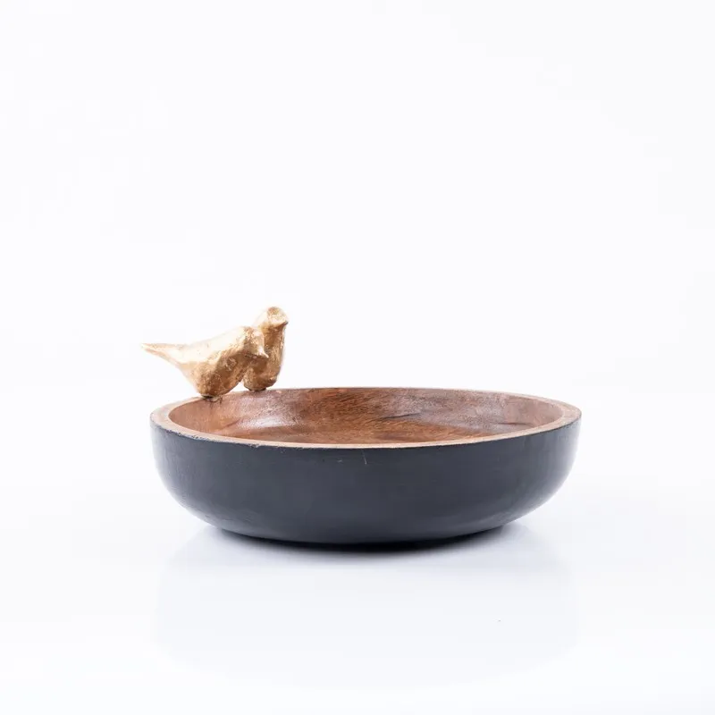 Pakshika wooden accent bowl shown front-on against a white background