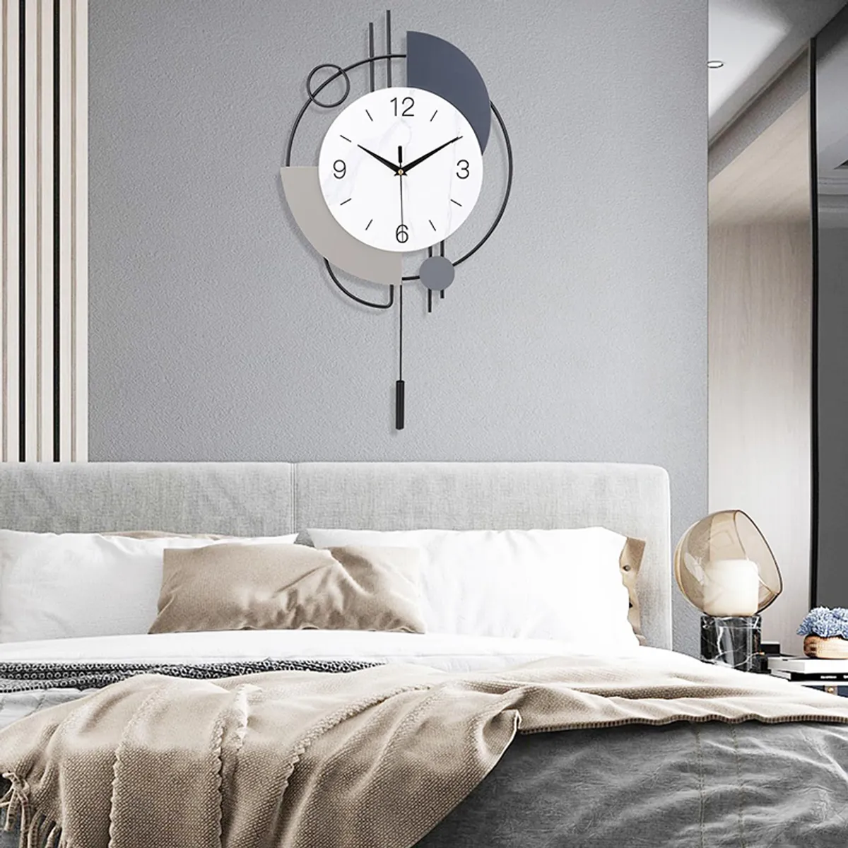 Geometric analog wall clock styled above a bed in a modern bedroom