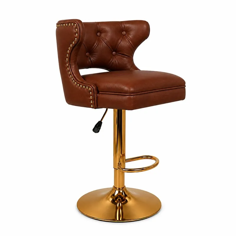 Three-quarter view of a maroon faux leather bar stool with a gold footrest and base.