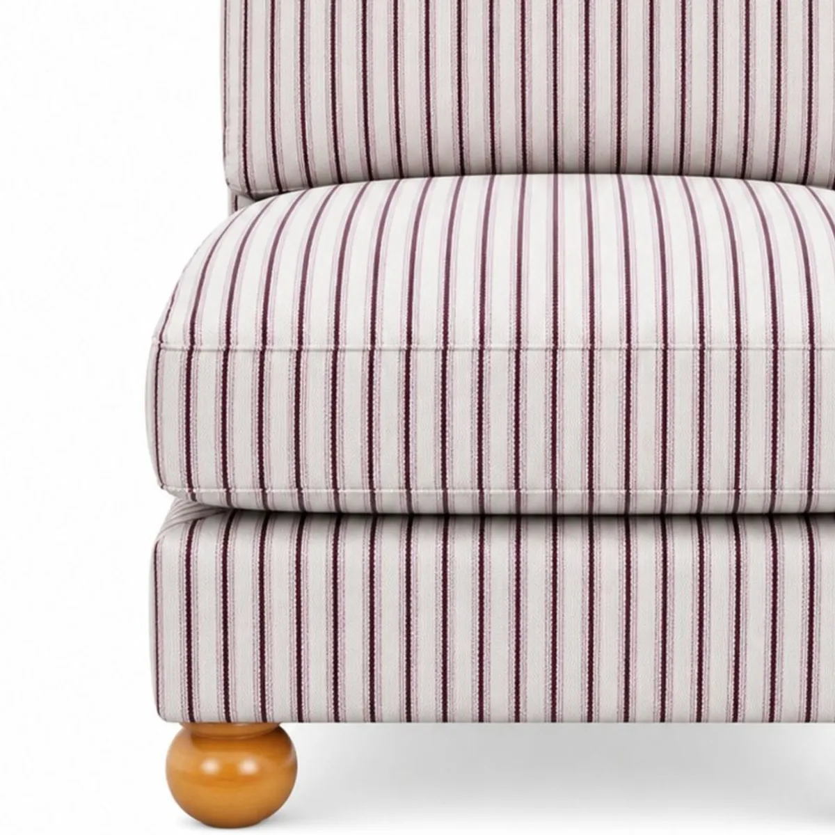 Close-up of striped suede upholstery and a rounded wooden chair foot
