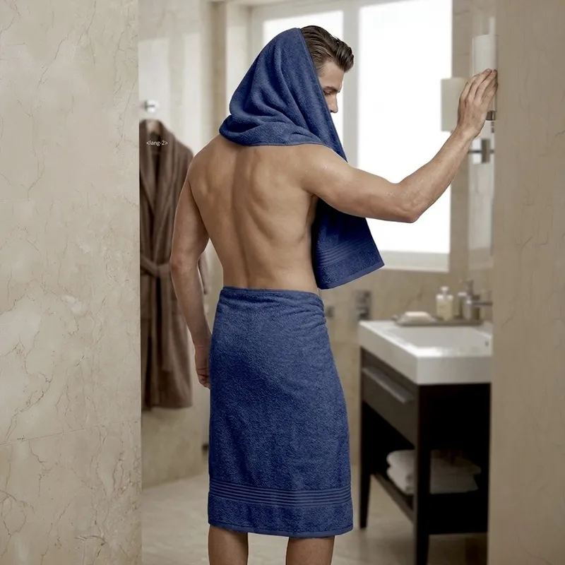 Man using a navy towel in a bathroom setting