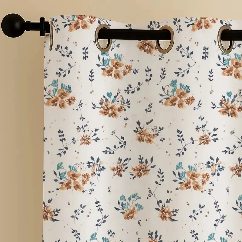 Close-up of eyelet header on floral printed white curtain