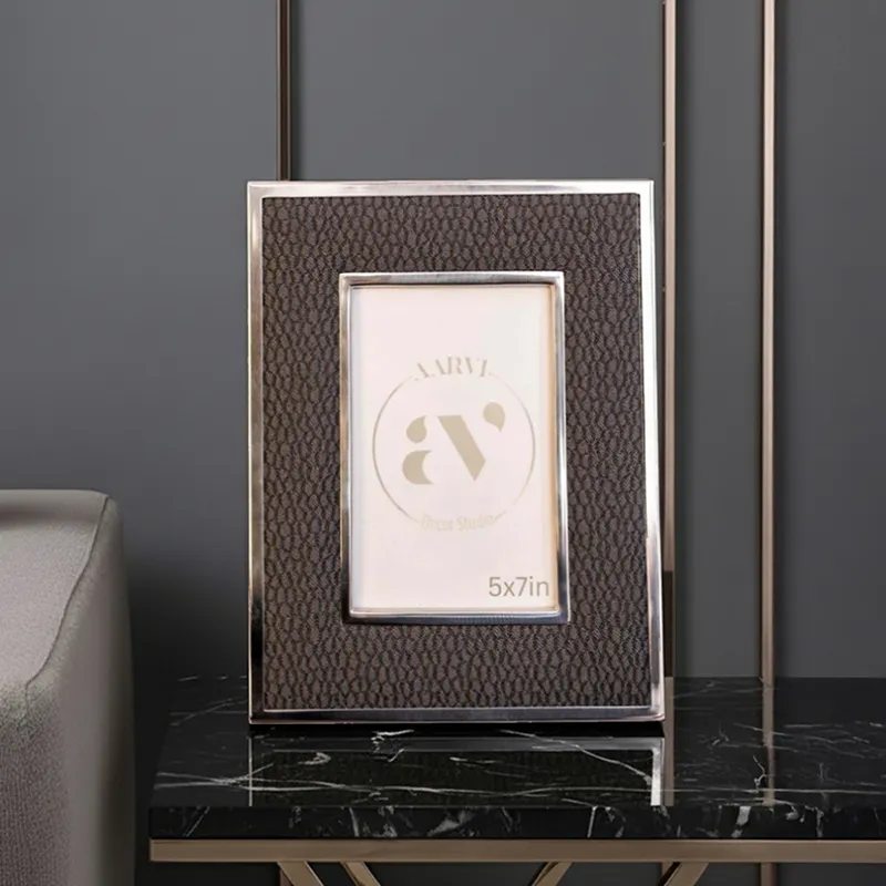 Black textured tabletop photo frame displayed on a dark console