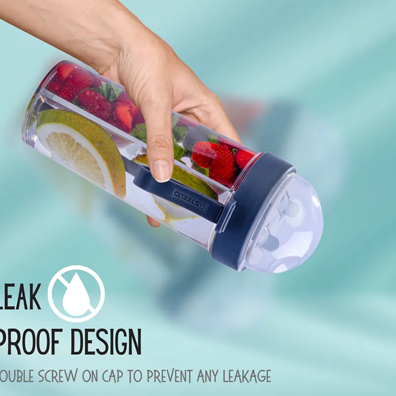 Hand holding a clear dual-compartment bottle with fruit-infused drinks
