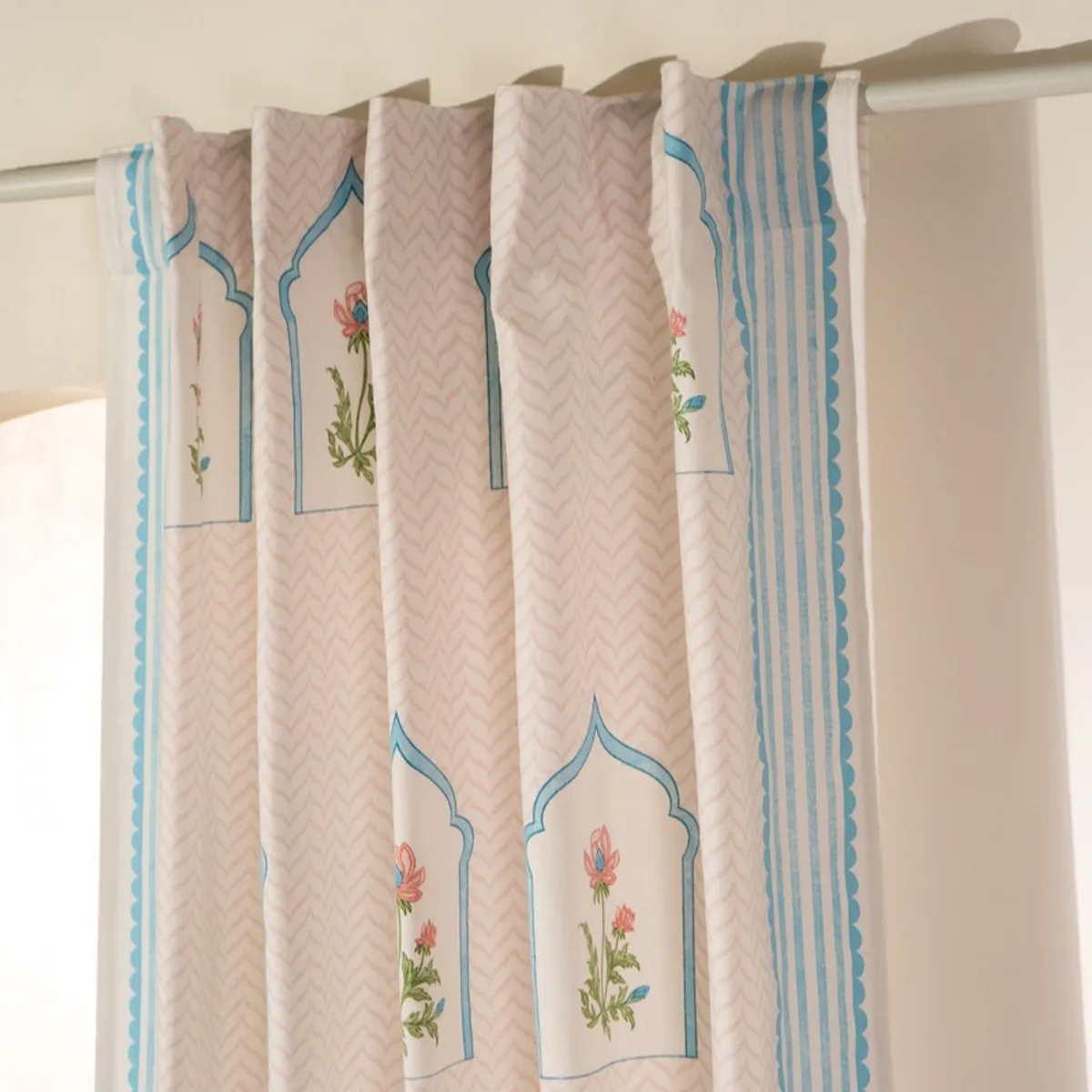 Close-up of back tab curtain heading with blue striped border