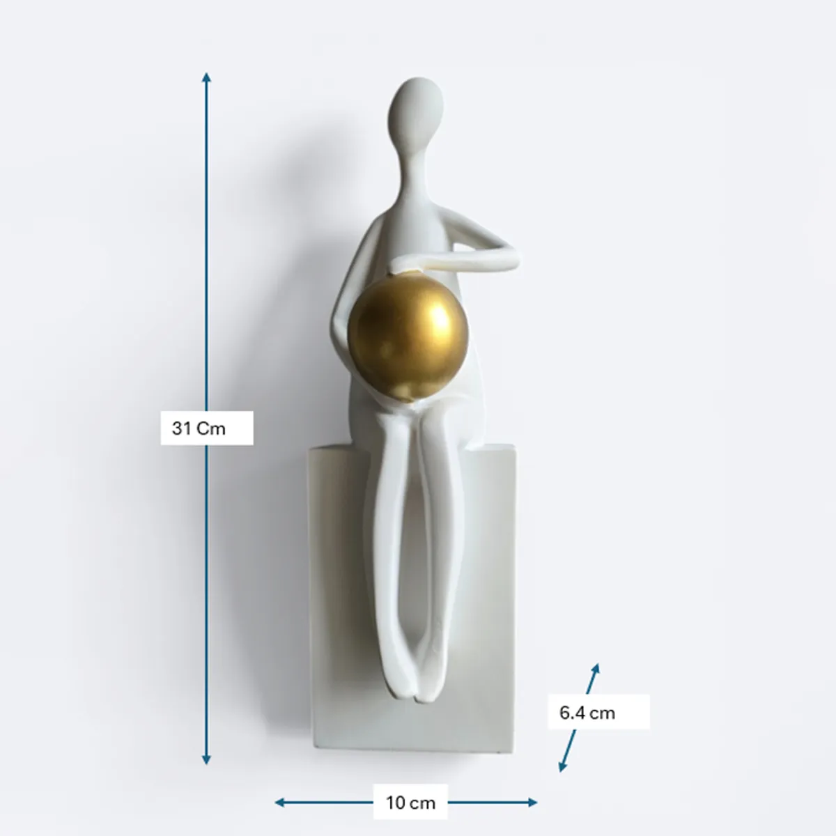 White abstract figurine with gold sphere shown alongside height and base dimensions