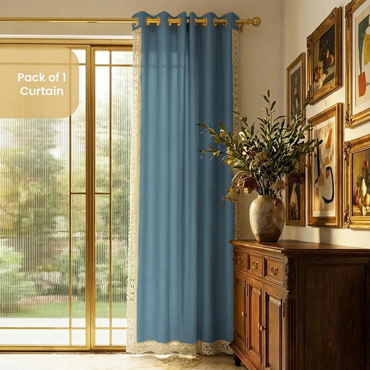 Blue curtain hanging beside a bright glass door