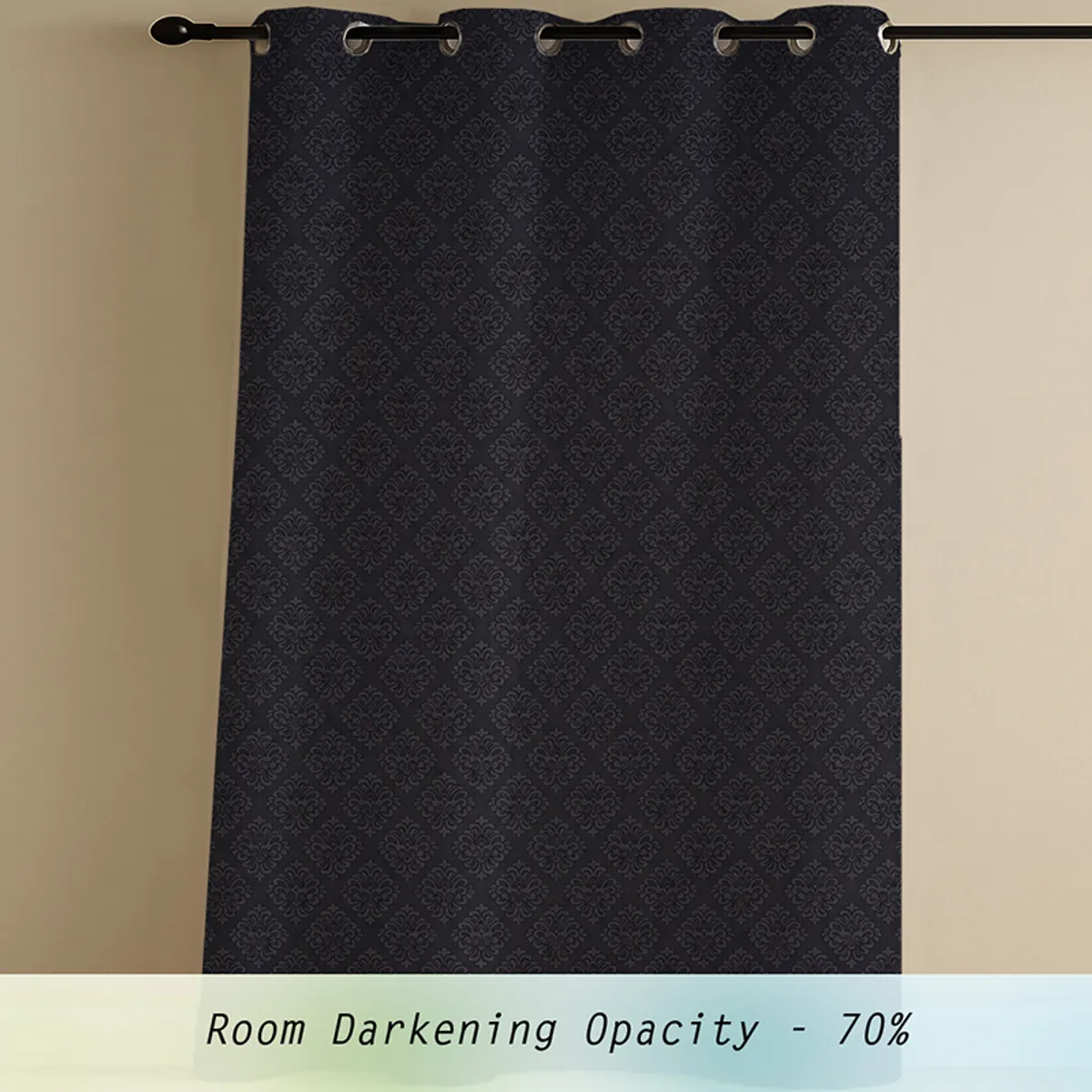 Black patterned curtain panel hanging from an eyelet rod
