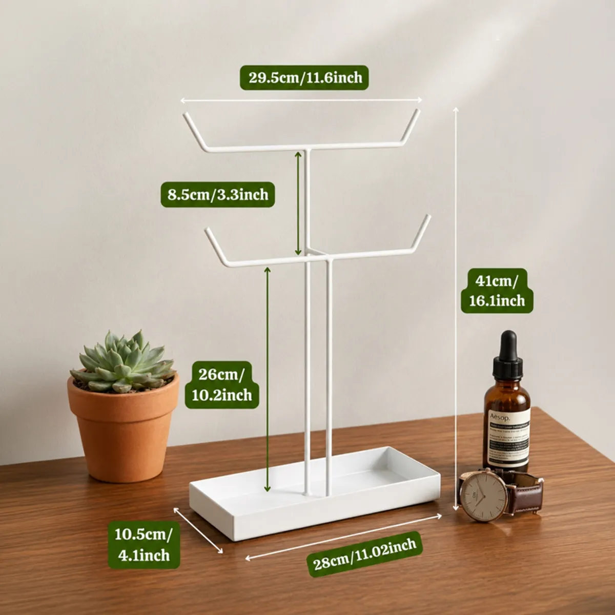 White jewellery stand shown with dimension markers against a neutral background.