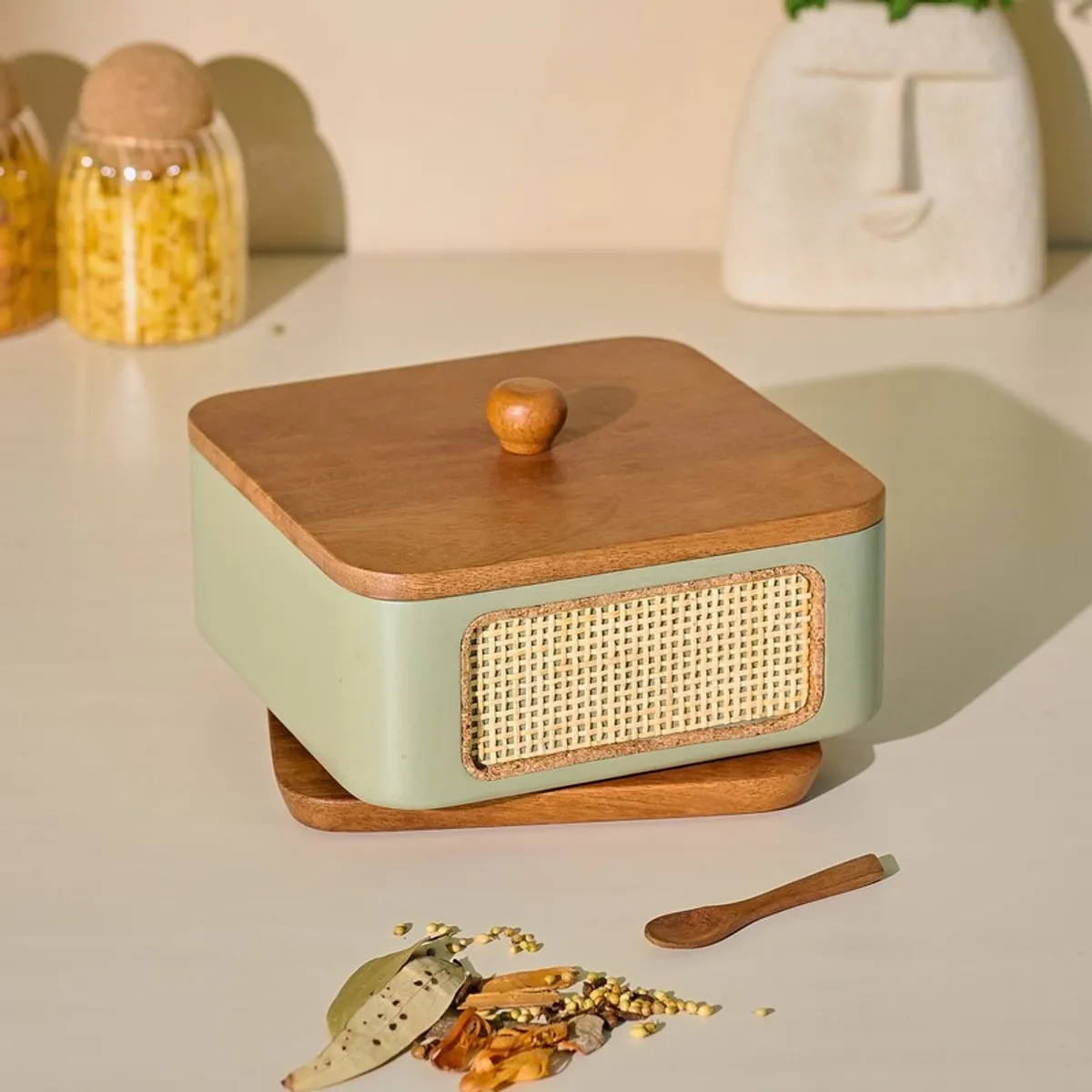 Closed square wood and green masala box with a textured front panel