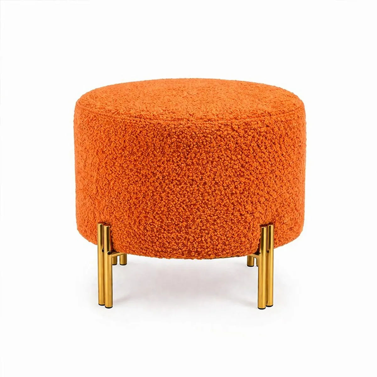 Front view of a round orange boucle ottoman with gold legs on white