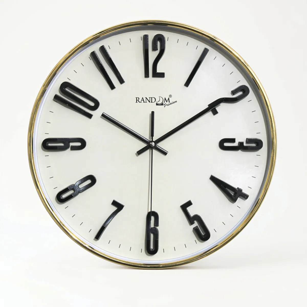 Close-up front view of a round white clock with raised black numerals