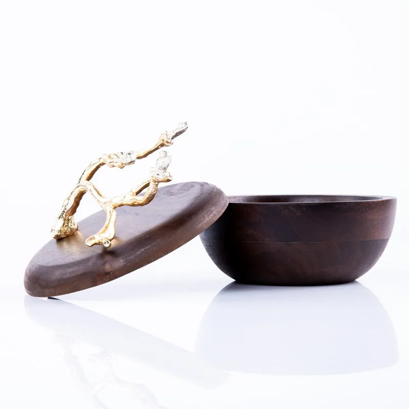 Open brown bowl and detached lid showing the branch-like ornament