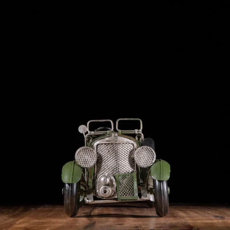 Front view of vintage racer iron showpiece with detailed grille and lamps