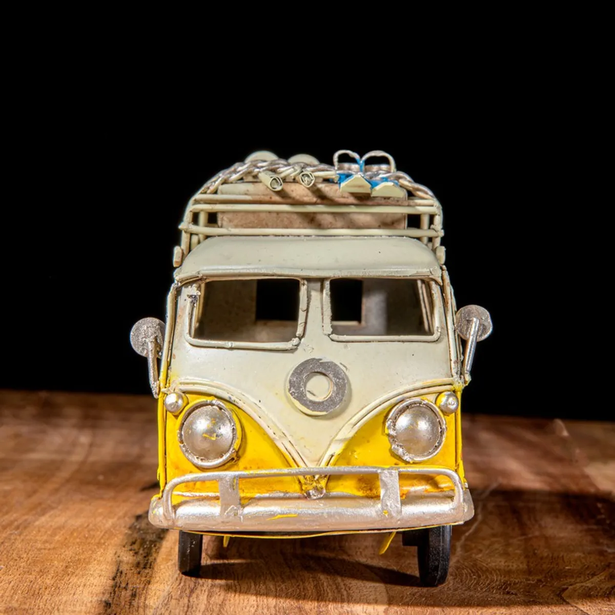Front view of yellow and ivory vintage bus iron showpiece