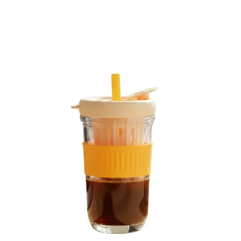 Orange and clear tumbler with infuser and lid on white background