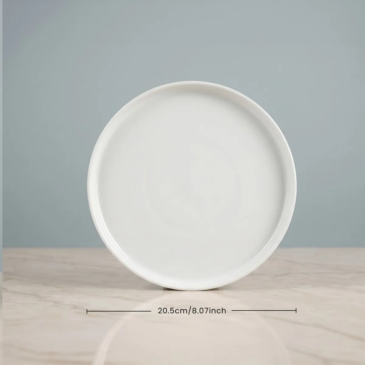 Single white round quarter plate displayed front on
