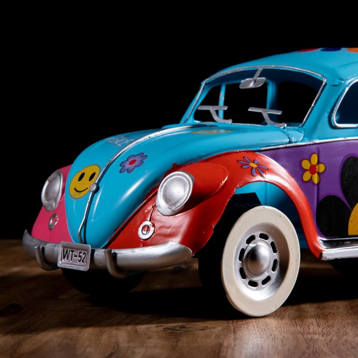 Close-up of the front section of the multicolour vintage car showpiece