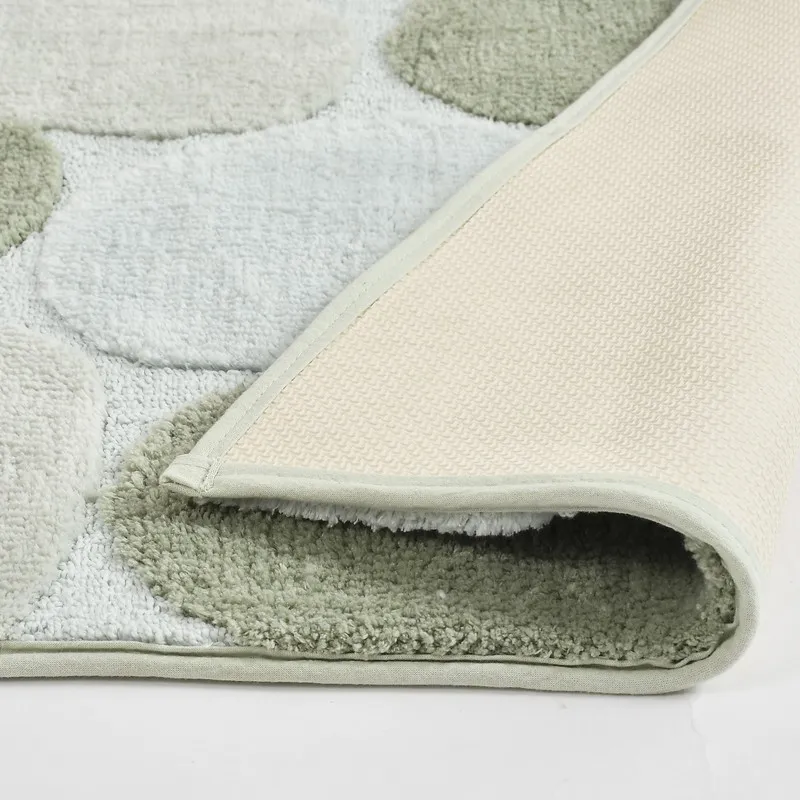 Close-up of bath mat corner showing textured surface and anti-skid backing