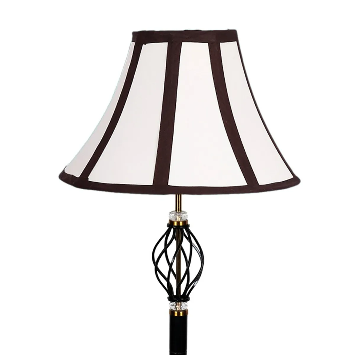Close-up of the white paneled shade and decorative black metal detail of the floor lamp
