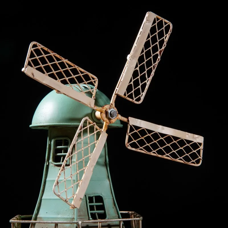 Close-up of the windmill blades and upper body of the blue showpiece