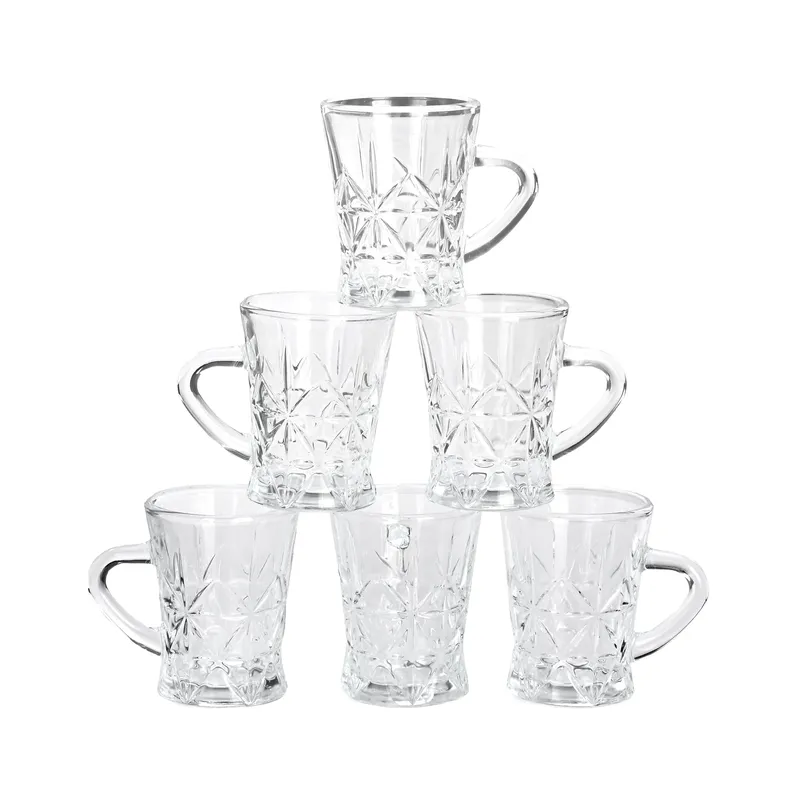 Six transparent glass tea cups stacked in a pyramid arrangement