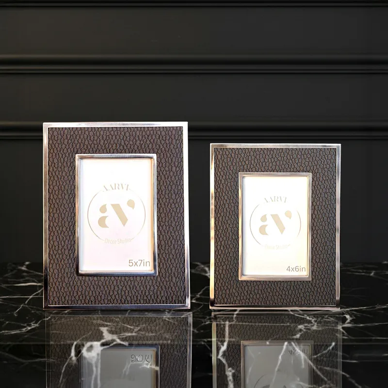Two textured photo frames with metallic borders displayed together