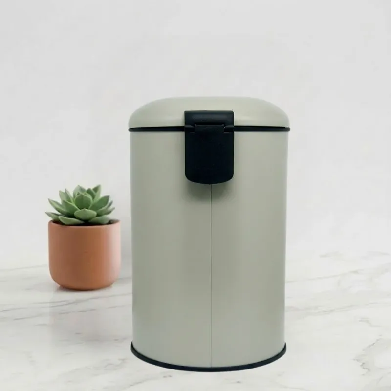 Rear view of the light grey cylindrical dustbin