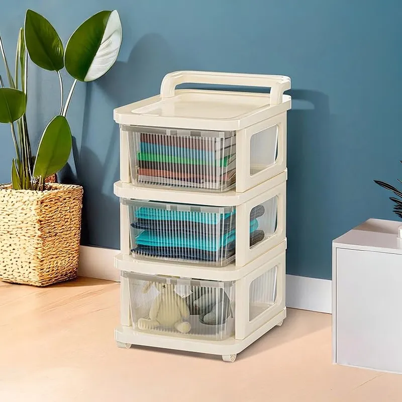 White three-tier storage rack with transparent drawers against a blue wall