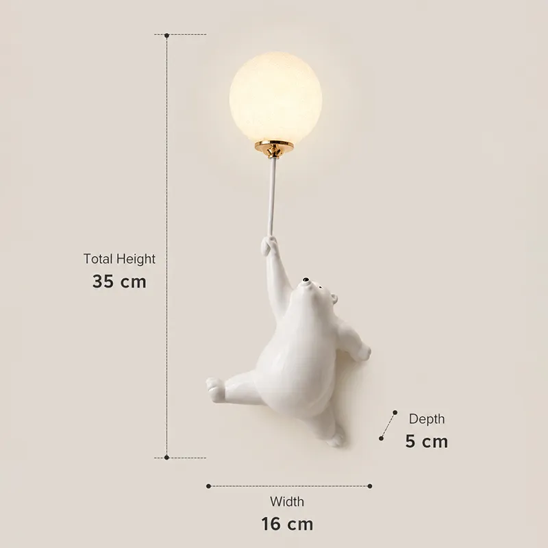 White bear wall lamp with glowing globe shown against a plain wall