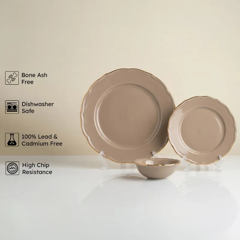 Grey and gold porcelain dinnerware set displayed on stands