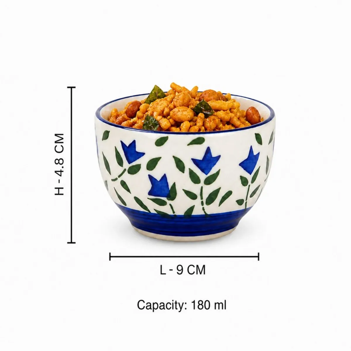 Blue and white floral ceramic snack bowl filled with savoury snacks