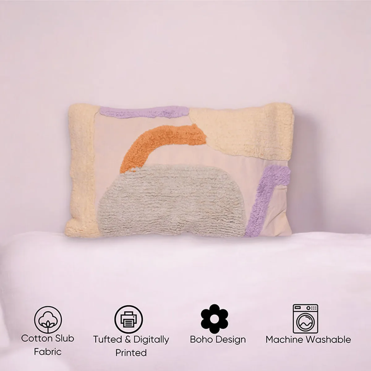 Front view of beige tufted cushion cover with orange, cream and lilac abstract pattern