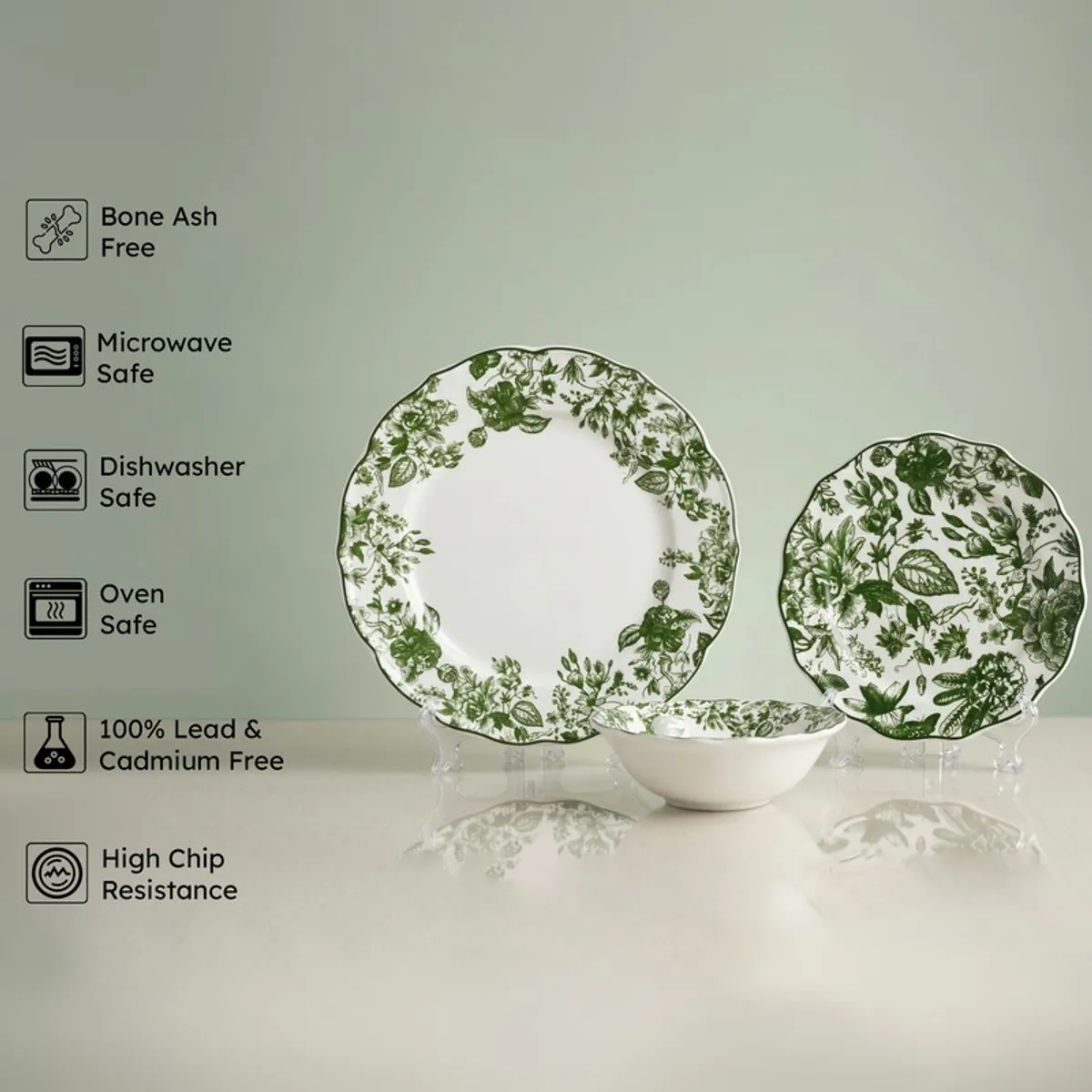 Floral green and white porcelain plates and bowl on display stands
