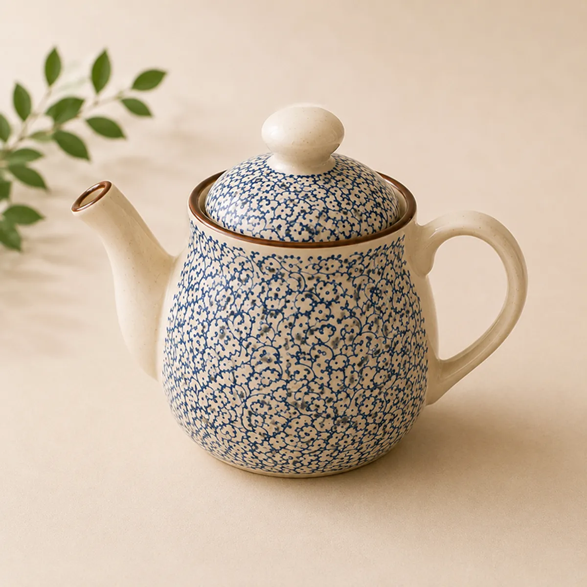 Close-up of the blue-and-white patterned ceramic teapot