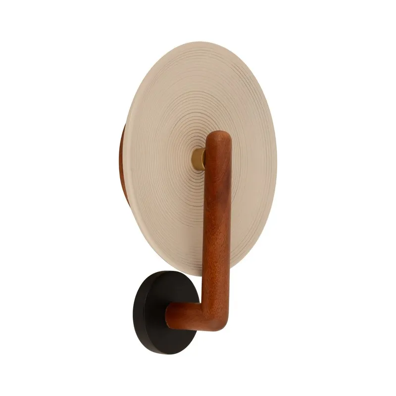 Angled product view of wood wall lamp on a white background