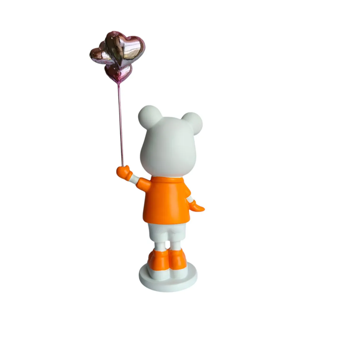 Rear view of the orange and white bear showpiece on its base