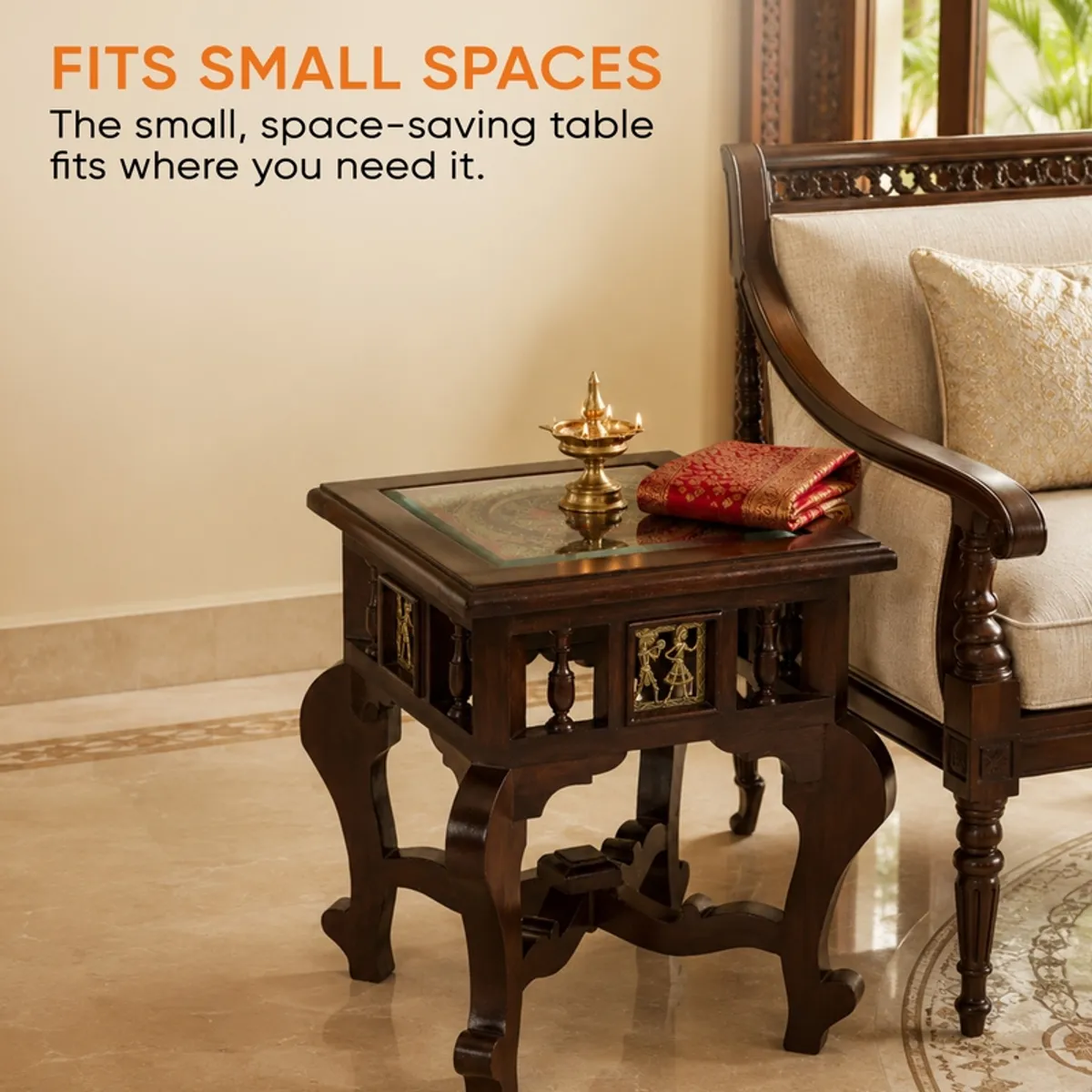 Brown square side table styled beside a carved armchair in a traditional room.