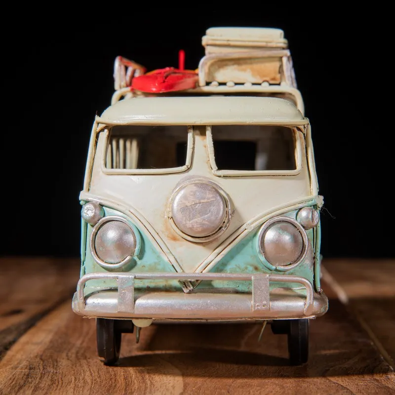 Front view of vintage caravan showpiece with blue lower half and ivory top