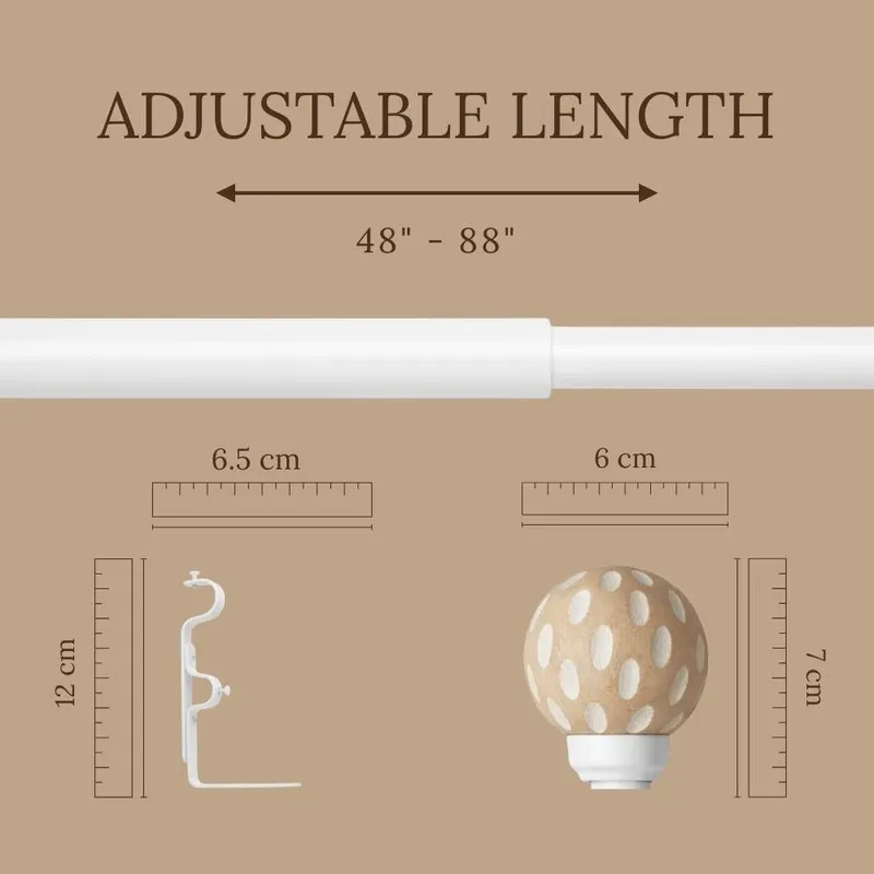 Close-up showing the brown polka-dot finial and white curtain-rod bracket.