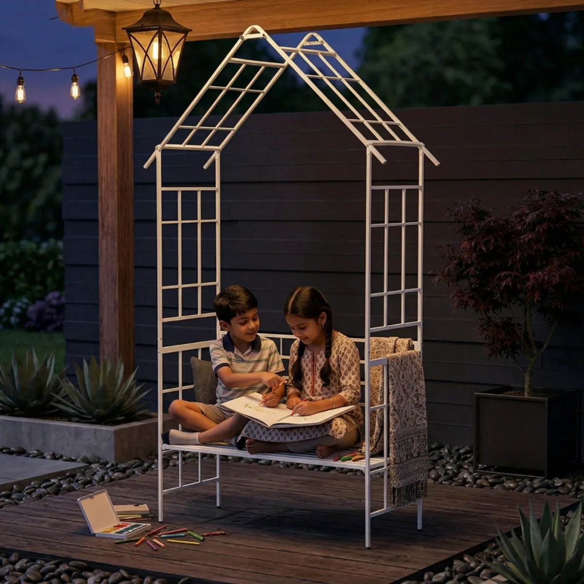 White garden structure with a bench beneath a peaked frame at night