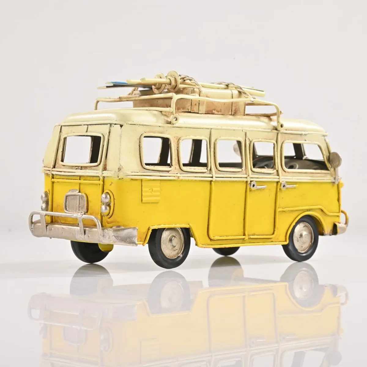 Back and side view of yellow and ivory bus decorative showpiece